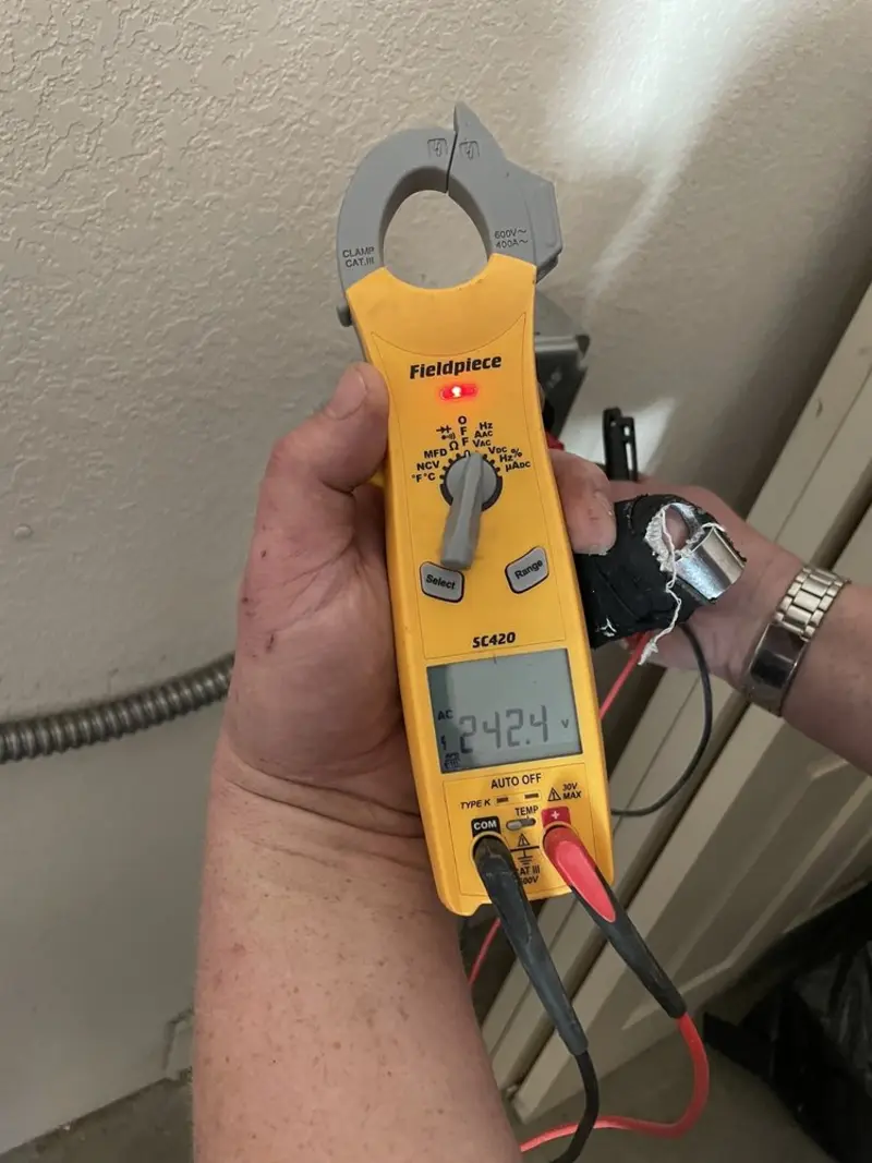 Voltage testing with clamp meter during Generator Installation in Monticello